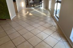 We can replace your aged tiles with a decorative flake floor finish - Before